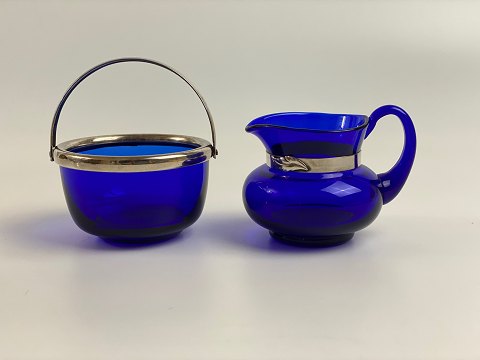 Sugar bowl and cream jug in blue glass with stain silver mounting