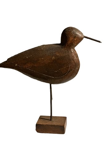 Sculptural and decorative bird / decoy carved from wood and standing on a wooden 
stand.