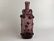 Beautiful old purple glass bottle / vase with 
glass threads and rosettes