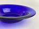 Old blue glass bowl molded in wood form