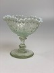 Old sugar bowl on foot; clear glass  with white 
ruffle edge