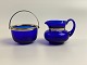 Sugar bowl and cream jug in blue glass with stain 
silver mounting