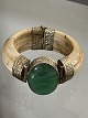 Vintage, ethnic bangle of bone (camel or cow) from 
the Middle Stone or India with large green stone 
and mounting of white metal / silver