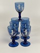 Mary Gregory cobalt blue wine glass, set of 7 
glasses with motifs of boy, girl and birds in 
landscape