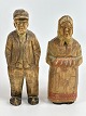 Pair of handmade, Danish wooden figures of a woman 
with a scarf and a man with a cap, circa 1950s.