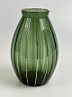 Rare glass vase in green and gold from the Danish 
glassworks Holmegaard. Moss green with optical 
stripes and gold stripes